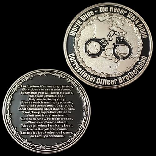 Two round metal coins; top coin features a globe with handcuffs and the motto 'WorldWide – We Never Walk Alone' around the edge, plus 'Constitutional Officer Brotherhood'.